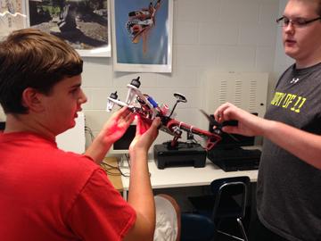 Showing his drone to junior Marshall Feldman, junior Brett Foster seeks to educate him about the way it works. Members help each other learn and have fun while in the Mad Scientists Club.
