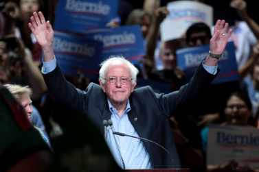 Holding his hands in the air, Bernie Sanders is a beloved candidate by the middle-class. His campaign promises try to help average people by attempting to raise minimum wage and granting free college tuition.