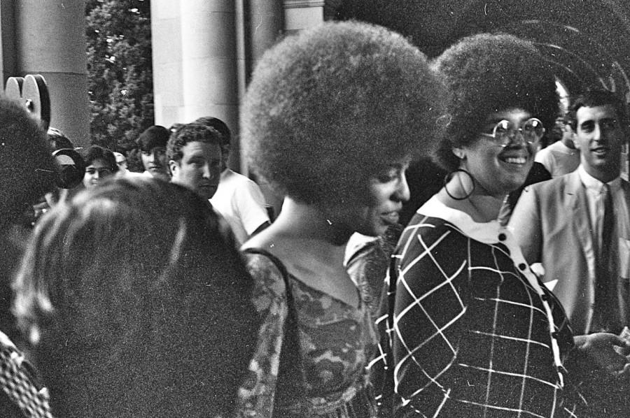 Smiling+towards+a+crowd%2C+Angela+Davis%2C+a+civils+rights+activist%2C+rocks+her+fro.+The+afro+was+a+symbolic+hairstyle+for+many+women+involved+in+these+organizations.+It+was+seen+as+rebellious%2C+yet+empowering.