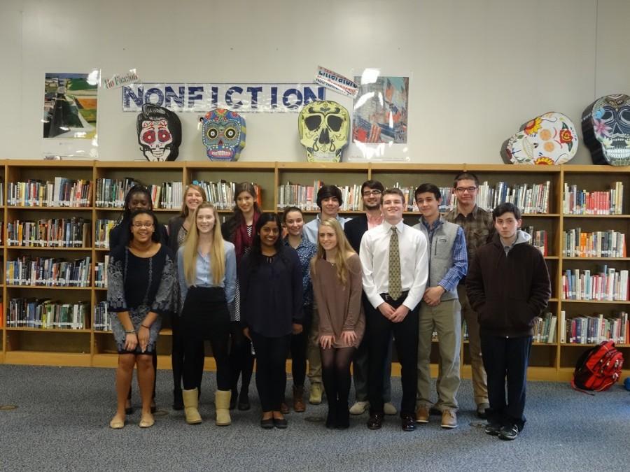 Posing for a picture, these IB seniors are excited and relieved, having just given their Extended Essay presentation. Each IB student is required to write an Extended Essay on a topic having to do with one of the classes they take.