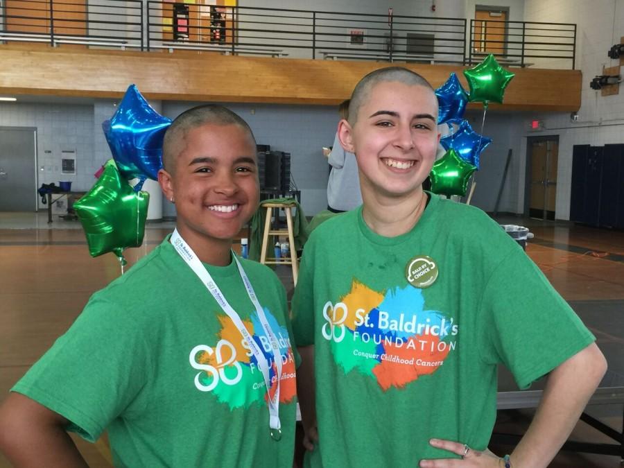 Taking a break from hugging all of their friends and family, Cat Talk staff members Juliana Martinez and Madisen Judge show off their new beautiful bald haircuts. They managed to raise three thousand dollars combined to help find a cure for pediatric cancer research.