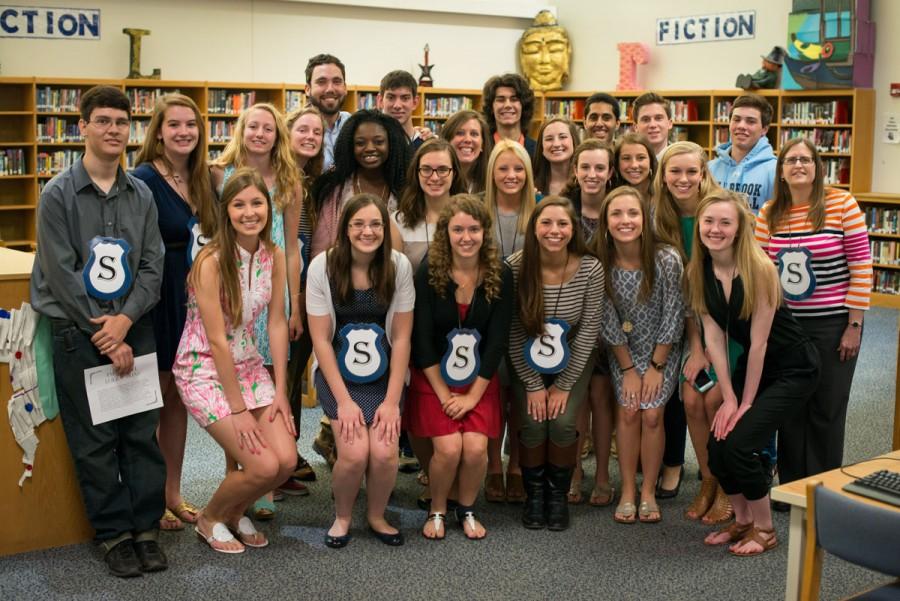 Members+who+were+inducted+into+Service+Club+last+spring+pose+for+a+group+picture+at+the+reception+in+honor+of+their+accomplishments.