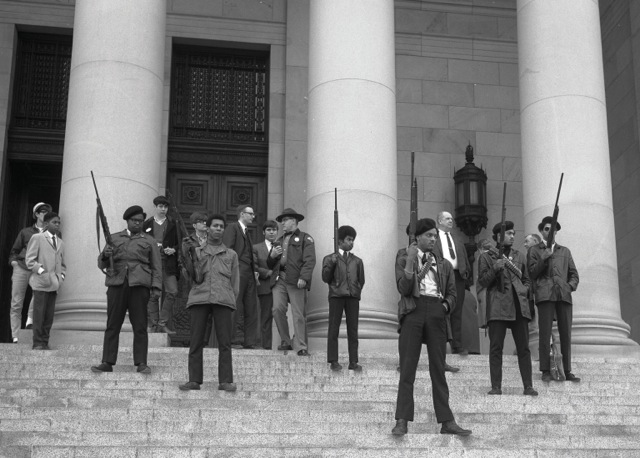 
Holding guns as an act of defiance, the Black Panthers Party for Self-Defense stand outside the California courthouse in protest of racist legislation involving firearms in the hands of black citizens in the 60’s and 70’s. The party sought to raise the standard for all black citizens and for them to be recognized as equals in the eyes of the law.


