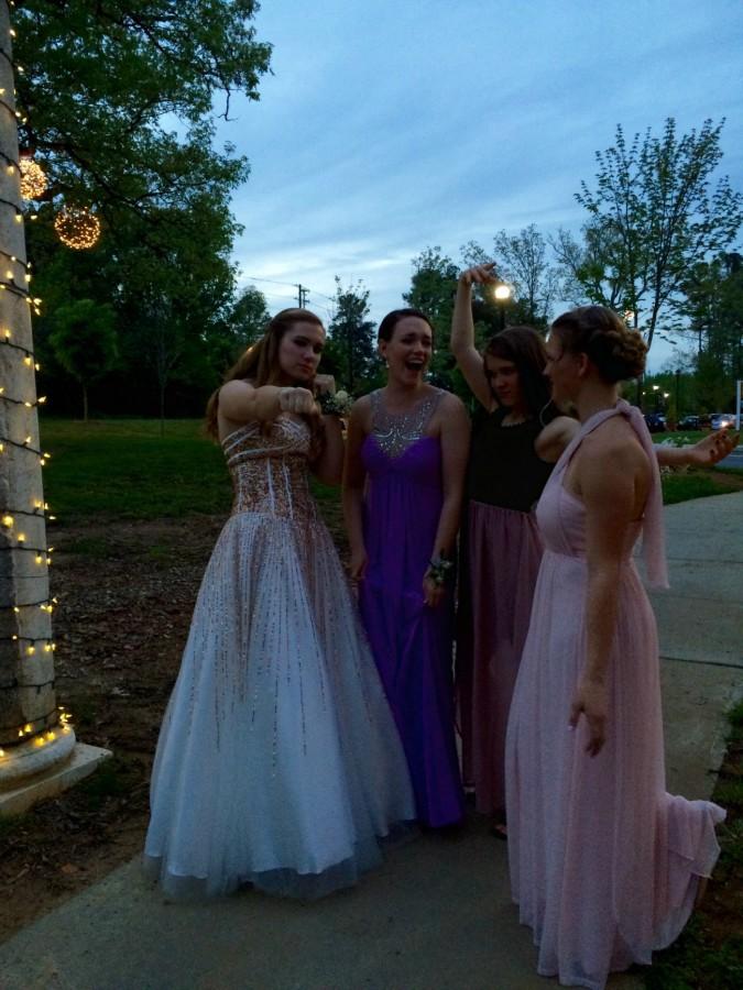 Located conveniently near North Ridge Country Club, LaFayette Village is a great place to both take pictures and eat before prom. After eating at Paparazzi (now Farina), seniors Lauren Hicks, Madeline Adams, Elizabeth Trefney, and Maria Boldt take their pictures for last year’s prom. 
