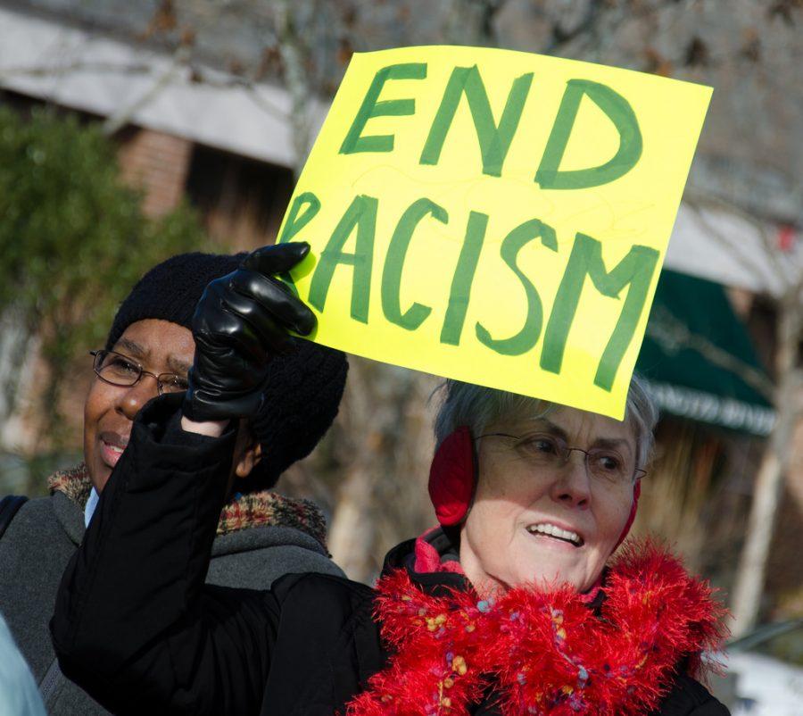 Striving to break racial barriers, crowd joins forces to protest racism. Forty-eight years following the Civil Rights Movement, discrimination and prejudice are still present in todays society.