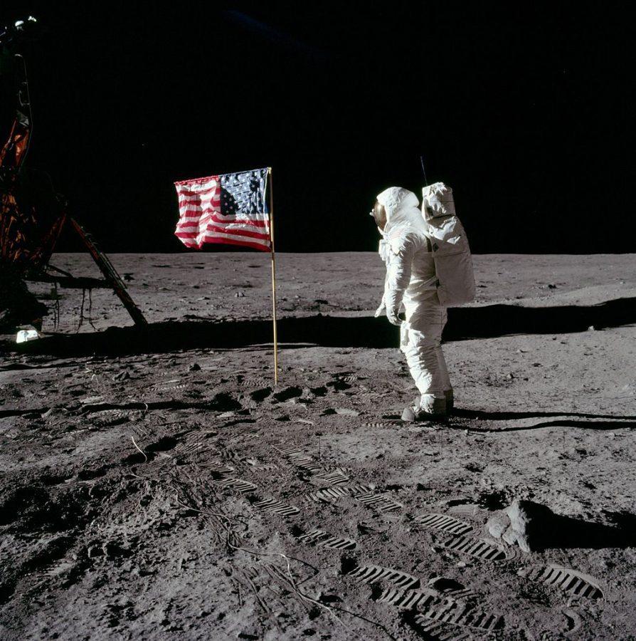 Standing proud after planting the American Flag into the surface of the the moon, Apollo 11 mission team is the first to walk on its surface. 45 years later, some theorists are still pushing the claim that the moon landing was a hoax. 
