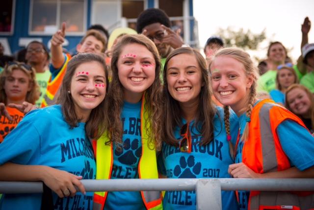 Cheering alongside her fellow maniacs, Jessica takes a break from the supporting the team to take a photograph with her friends. Pictured left, Jordan Stallings describes Tomlinson as a “selfless and compassionate person who has a calling for service.”
