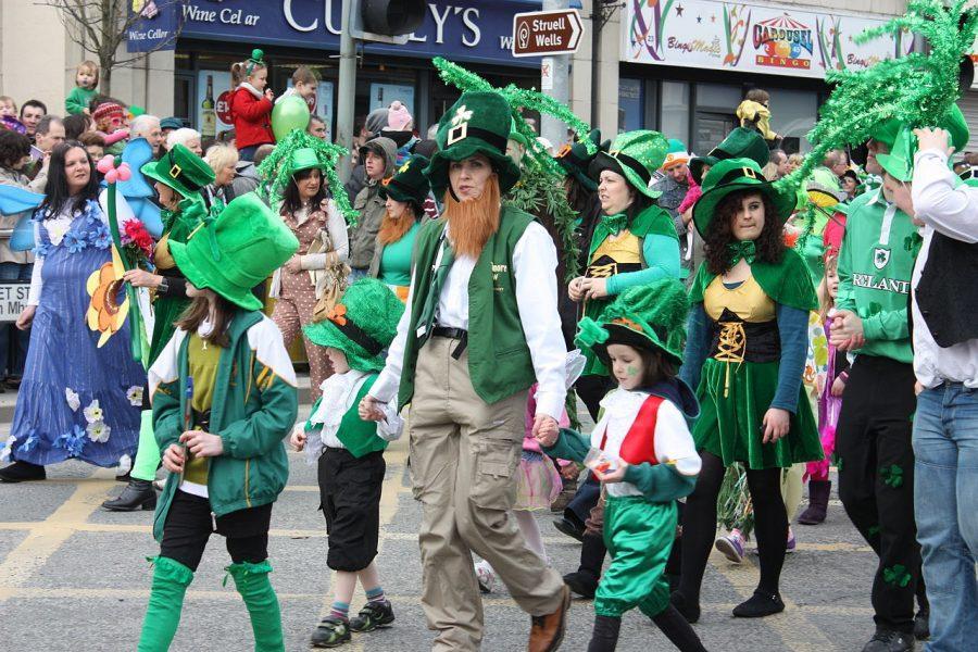 Walking the streets, parade goers celebrate Saint Patricks day by wearing festive costumes. This is just one of the many ways that Saint Patricks day is celebrated.
