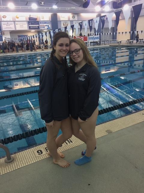 Participating+in+one+of+many+swim+meets%2C+Emily+stops+to+pose+for+a+picture+with+teammate+Talley+Krause.+Emily+Scarboro+is+a+well+rounded+student+athlete+that+is+involved+in+many+aspects+of+Millbrook.%0A%0A