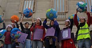 Protesting in front of a public building, women in Barcelona, Spain show their support on International Womens Day.  This day is celebrated all over the world by men and women who believe in equality for both the genders.