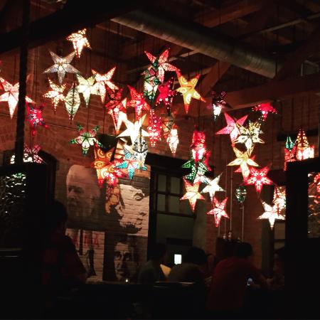 Shining brightly overhead, an array of star lights enliven the dining room at Gonza Tacos y Tequila. The surrounding pop-art features prominent Latin American figures, such as Frida Kahlo. Book your reservation at gonzatacosytequila.com 
