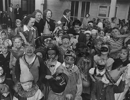 Celebrating what is now known as Halloween, this group of children is dressed up to prepare to trick-or-treat. The rich history of Halloween is often unknown to the public with how much it has gone through even after the European colonists came to the United States.