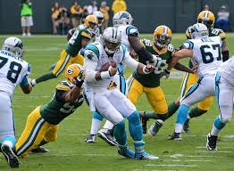 Battling against the Green Bay Packers in a intense game of football, the Carolina Panthers try  to score points to win a tough game. The Carolina Panthers, currently owned by Jerry Richardson, will be up for sale at the end of the season.