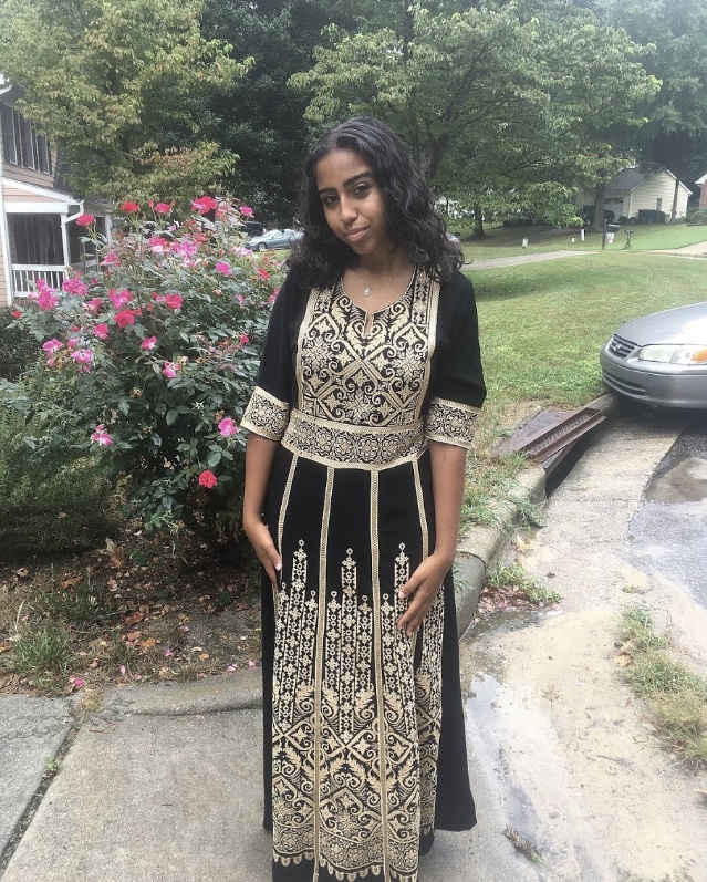 Embracing+her+Muslim-Moroccan+heritage%2C+Yousra+dresses+in+an+abaya+to+celebrate+Eid-al-adha.+Yousra+takes+pride+in+her+faith+and+culture+and+contributes+to+the+cultural+diversity+of+Millbrook.+
