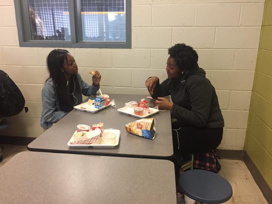  Eating nutritional lunches bought at school, Millbrook student Cayla Finch enjoys her break from classes. During the long holiday breaks and weekends there is no other way for students to get meals provided by the school.
