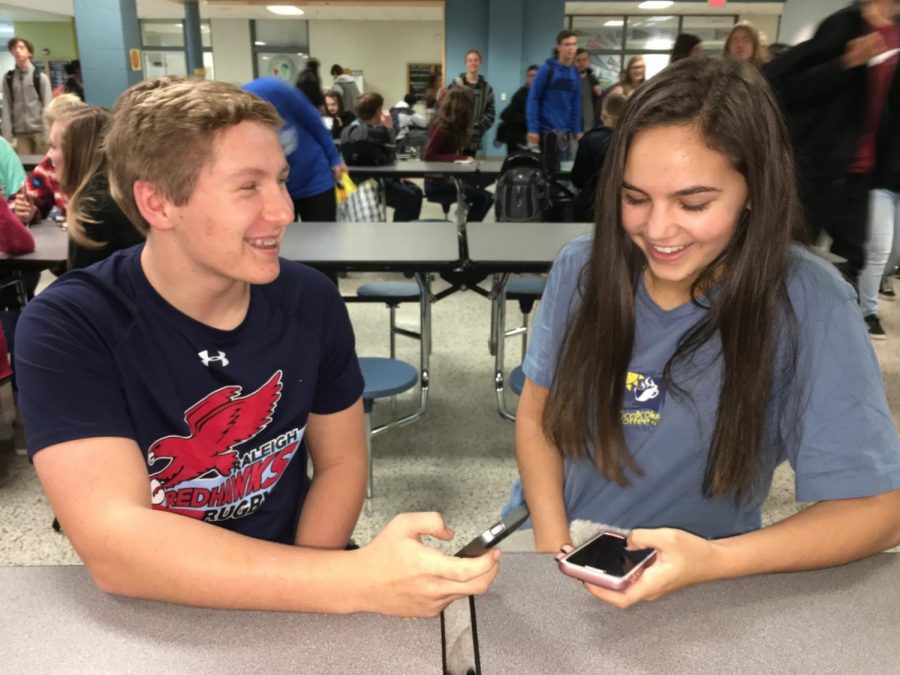 Enjoying each others company, Elizabeth Iager and AJ Kurke try to hold a conversation with each other without being distracted by their phones.