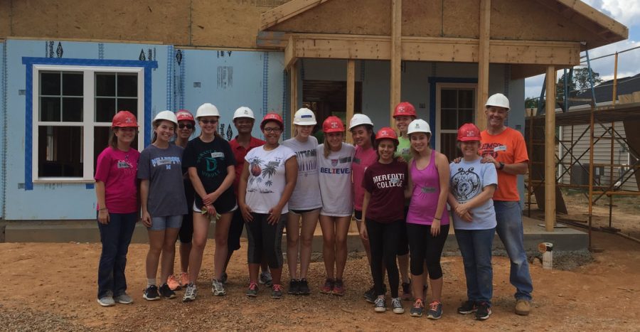 Celebrating a hard day of volunteering at Habitat for Humanity, members of IB programme line up for a picture. These students see their graduation in the near future, but continuously work hard to strive for future success.