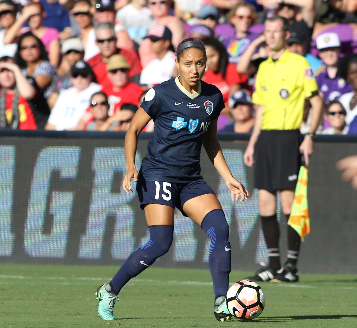 Dribbling the ball up the field, number 15, Jaelene Hinkle, looks to score during a game. The NC Courage are currently on top of the standings in the NWSL, the most prestigious women's soccer league in the U.S.