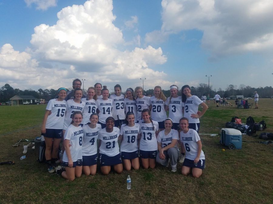 Celebrating after another hard fought victory, the Women’s Lacrosse team takes a team photo. The team is filled with girls that believe their hard work will lead to more team success. 