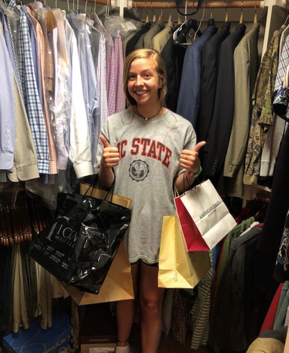 Posing with shopping bags, I give a big thumbs up to shopping in the store. Aren't these more fun to open than a box?