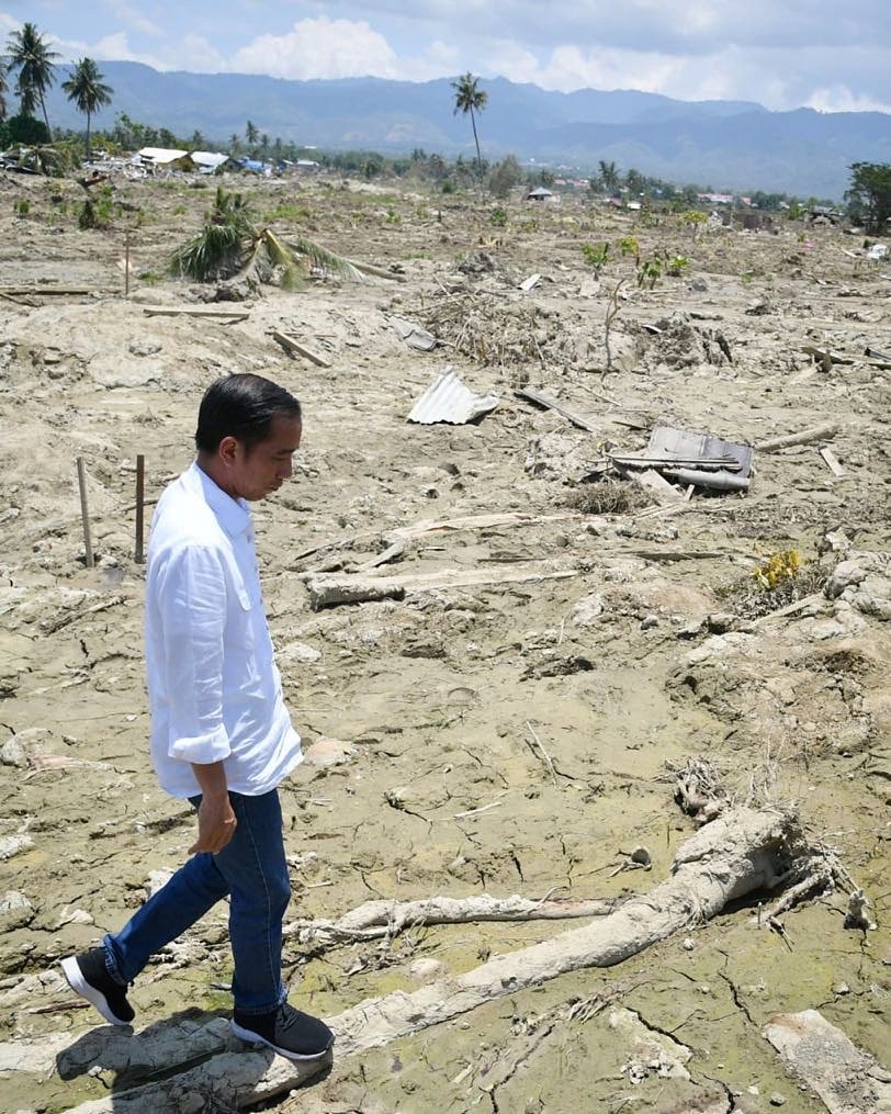 The President of Indonesia, Joko Widodo, walks around the city of Palu. The previously lively city has been demolished to sandy earth by the 7.5 magnitude earthquake and 18-foot tsunami that slammed the area on September 28, 2018.