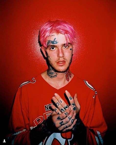 Posing for his album cover, American rapper Lil Peep later released “Hellboy.” He died in 2017 due to an accidental overdose of Xanax and fentanyl, after leaving his legacy of “emo” rap.