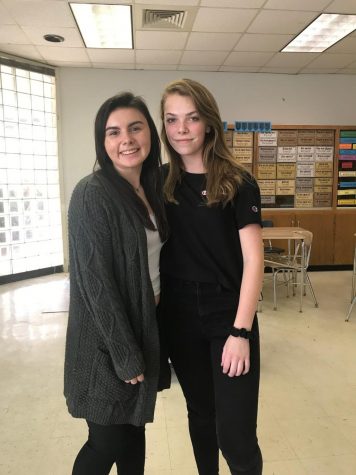  Presidents of the American Sign Language Club, Ashley Taris, left, and Ashlynn Hamilton, right, pause for a picture after finishing one of their meetings. They hope to increase the amount of members in the club and help spread their love of the language.