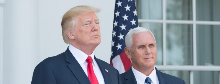 Looking off into the distance, President Trump is pictured with Vice President Mike Pence. Both men are included in a conspiracy theory that involves time travel, two late nineteenth-century books, the death of Nicola Tesla, and more!