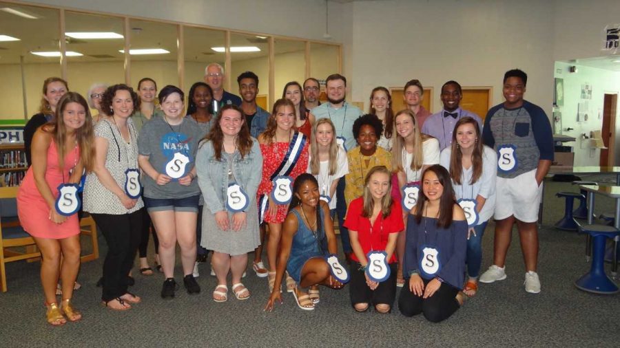 Smiling bright, new members of Millbrook’s Service Club celebrate being inducted into this highly selective club. Service Club honors students, faculty, and community members who go above and beyond in the Millbrook community and defines what it means to serve.