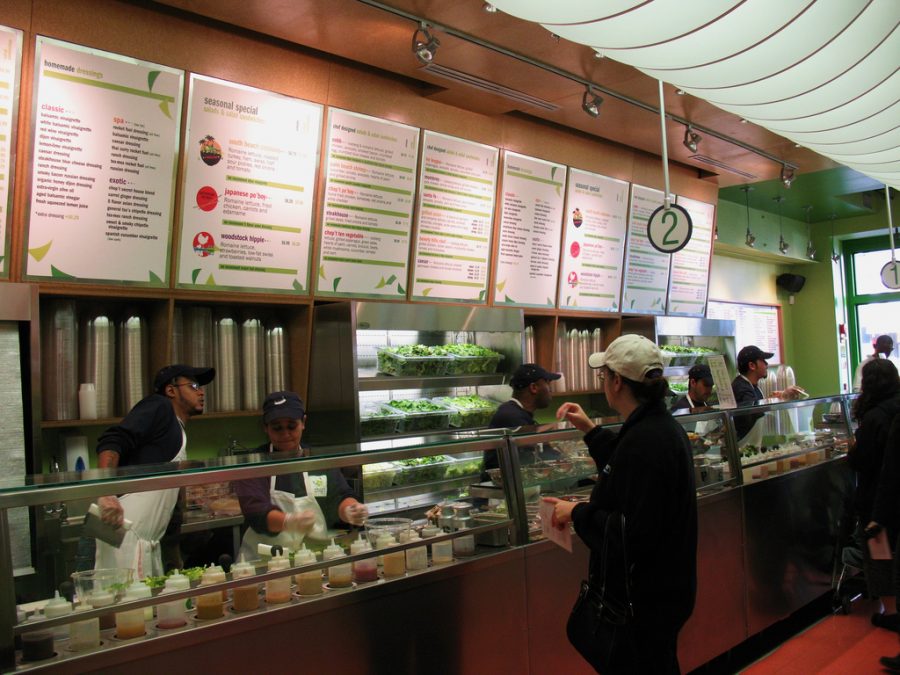 Giving her order to an employee, this customer orders a custom-made salad at the Chopt salad bar. Chopt is one of the numerous options in Raleigh for delicious salads, which make National Salad Month easy to celebrate.