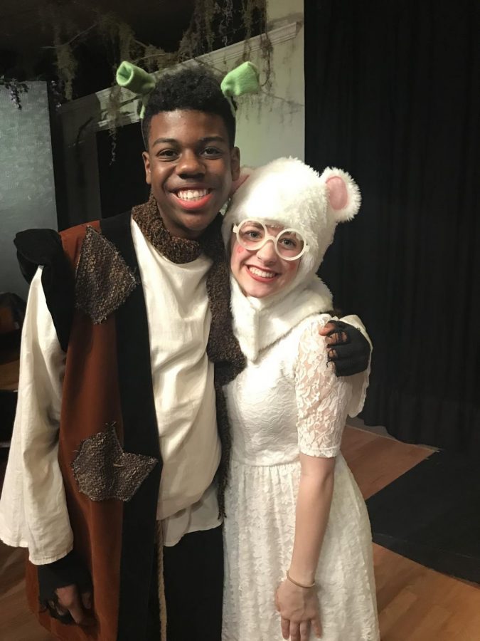 Standing next to his former cast member, Christian smiles after a successful performance of Shrek. Theatre and the arts is something that Christian is very passionate about in and out of school.