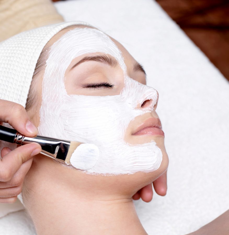Getting a facial, this person takes time to care for her skin by going to the spa. There are many ways to pamper yourself and improve your skin, including moisturizing, exfoliating, monitoring your diet, using all-natural beauty products, and more.