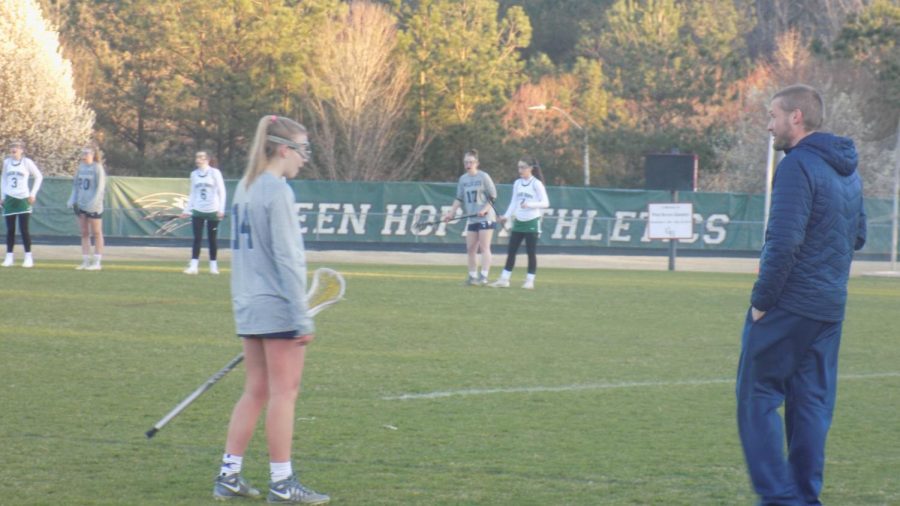 Standing on the field, coach Cope observes his team practicing for an upcoming game. Teaching others while having fun is the best of both worlds for this spectacular staff member!