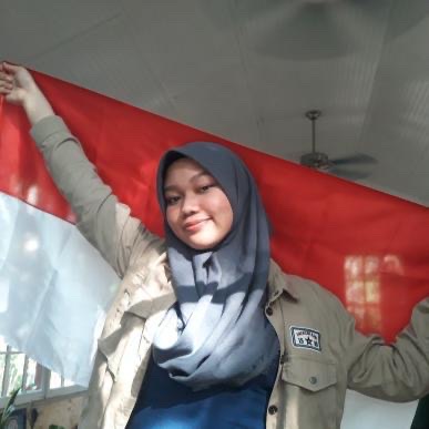 Posing with the official Indonesian flag, junior Farhanah Arifah wants to share her unique culture with all of Millbrook High School. By sharing different cultures, one will be able to connect with and communicate with people from those societies. 