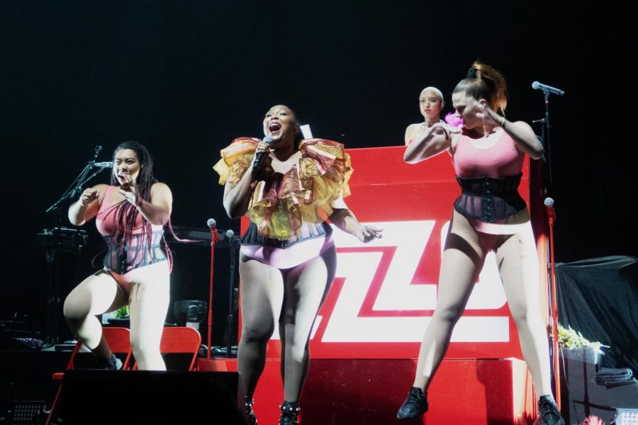 Performing+to+her+large+fanbase%2C+breakout+sensation+Lizzo+sings+and+dances+for+an+enthusiastic+crowd.+Lizzo+and+her+team+of+backup+dancers+always+seem+to+get+the+crowd+on+their+feet+during+a+performance+with+their+fun+dances+and+catchy+tunes.+