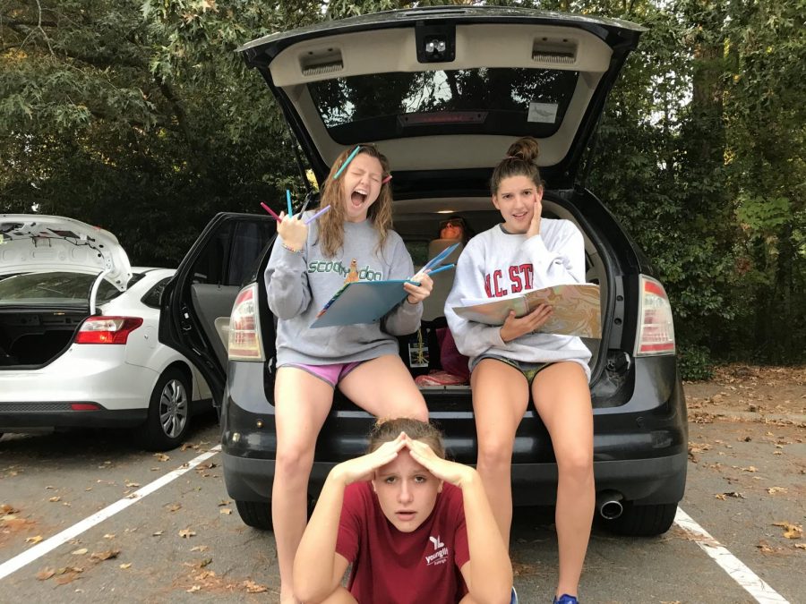 Rushing to complete their assignments, senior Genny Hauser (top left), junior Sydney Hartis (top right), and junior Michaela Teachey (bottom) are visibly stressed. With high school yielding such a large workload and an internal brain struggle to finish required assignments, students often procrastinate as a result of the compounding pressures.