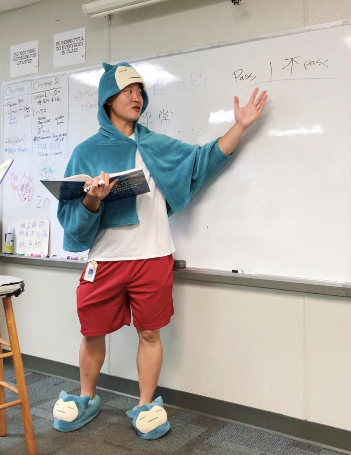 Showing off his school spirit on Morning Monday, Mr. Jung explains a fun activity to help his Chinese 2 class learn their new vocabulary. He considers himself lucky to teach students who are hard-working, studious, and willing to learn, which solidifies his confidence as a teacher.

