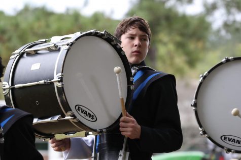 Performing for Millbrook’s marching band, junior Ryan Gibson drums to the beat. Ryan serves as a section leader and is a great role model for younger band members.
