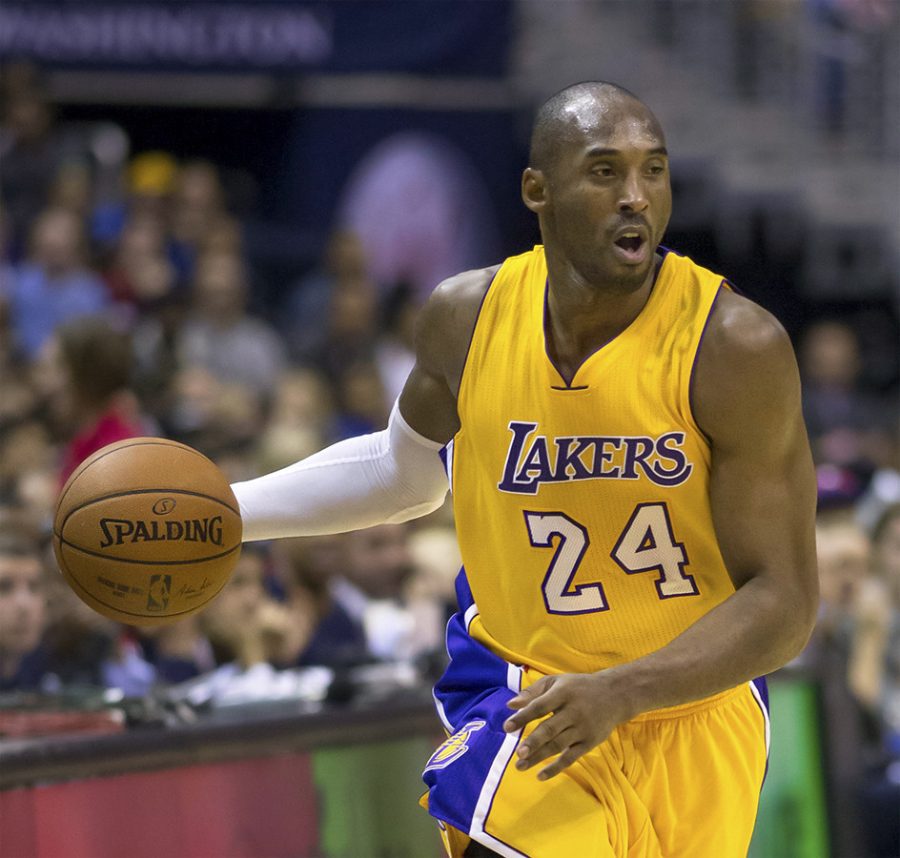 Dribbling the ball down the court, small forward and shooting guard Kobe Bryant plays in one of the last games of his career. Bryant was killed this morning due to a helicopter accident. 