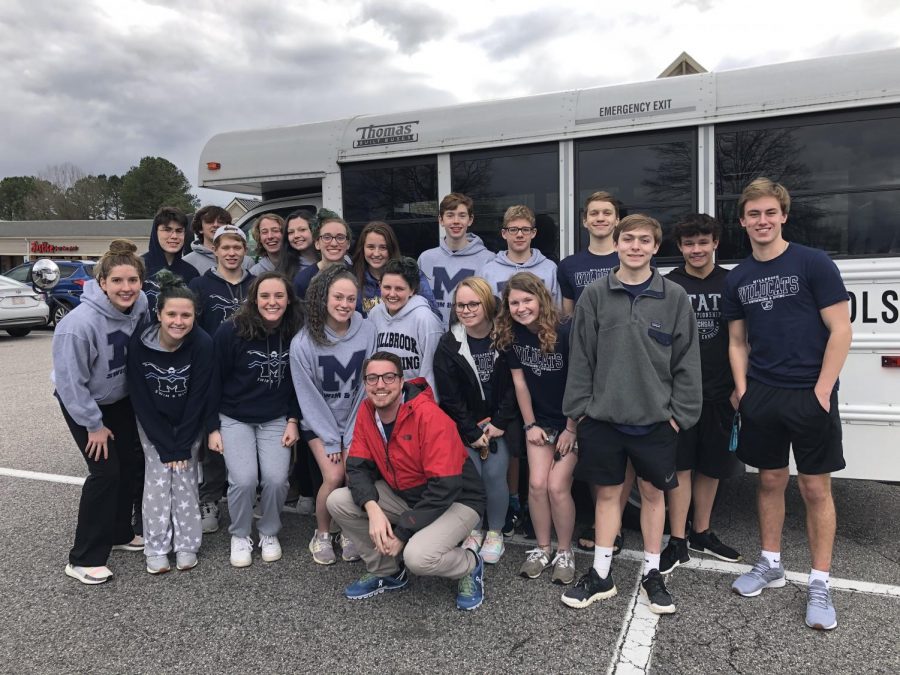 Overjoyed by their successes and a fun bus ride, the Millbrook Aquacats States qualifiers pause to pose for the camera after enjoying a delicious meal together! This picture was taken in between the prelims and finals sessions of their final swim meet of the year.