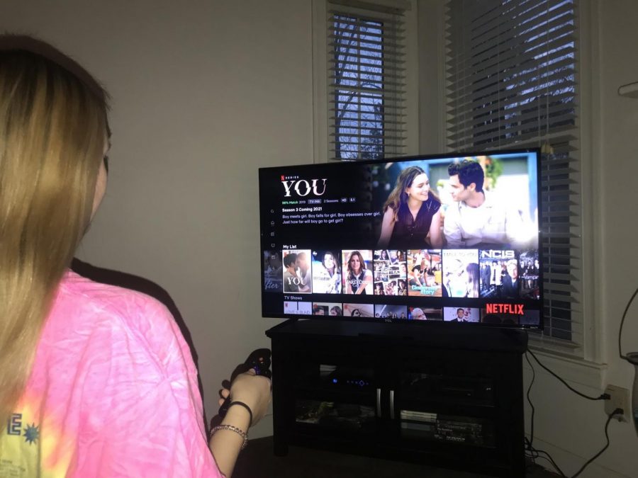 Turning on her TV, Lauren Jones browses Netflix to pick a show to watch. Watching TV shows and movies allow us to relax and de-stress. 