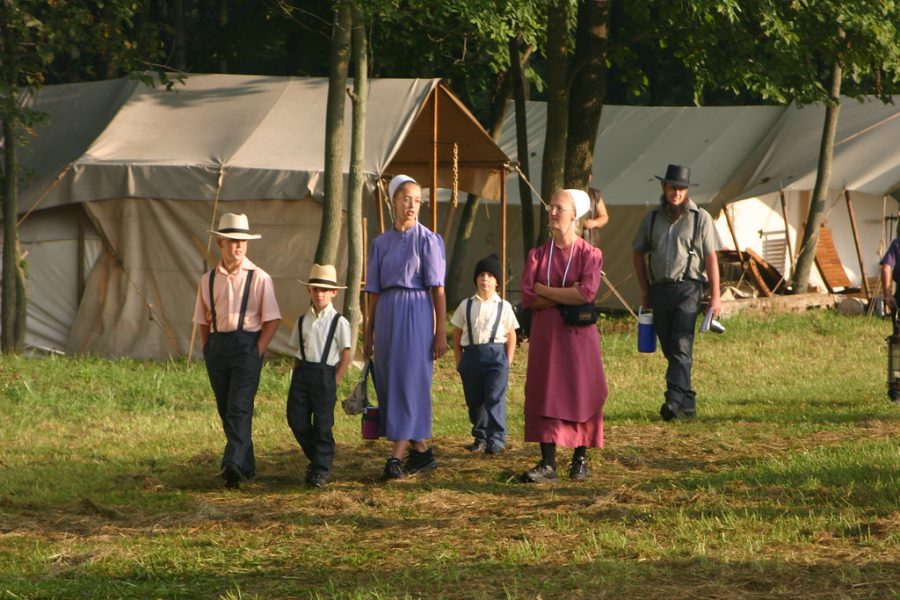 Walking hand-in-hand, an Amish family heads through their community. The Amish cherish their family and spend time with one another as much as they can.