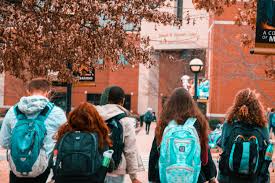 Walking to class, these college students enjoy fellowship and their ability to learn together. As the COVID-19 outbreak has cancelled testing, the UNC system has made admission modifications for those who were unable to redeem themselves during the rest of their high school semester. 
