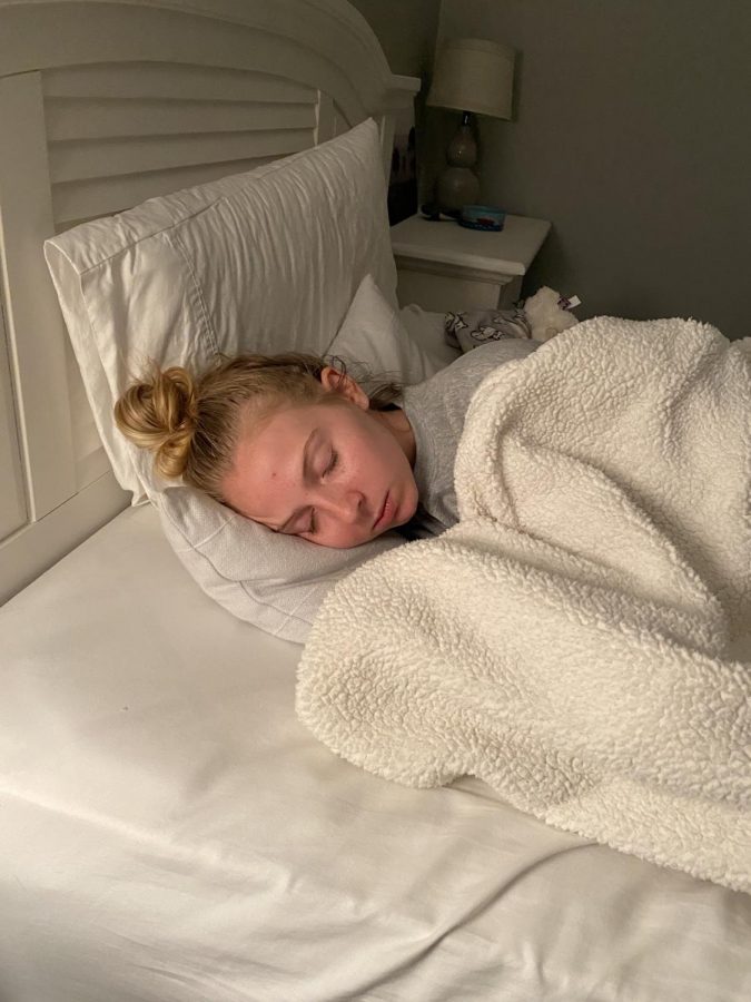 Catching up on her sleep, senior Allie Bettenhausen demonstrates how she uses her free time due to our two-month break. Read to see what you can be doing to make the most of your time!