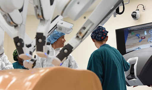 Practicing an invasive procedure on this test dummy, these Air Force medical students had the opportunity to work using the daVinci robotic surgical system. More medical advancements such as this one are being used to treat patients with increased precision and effectiveness.