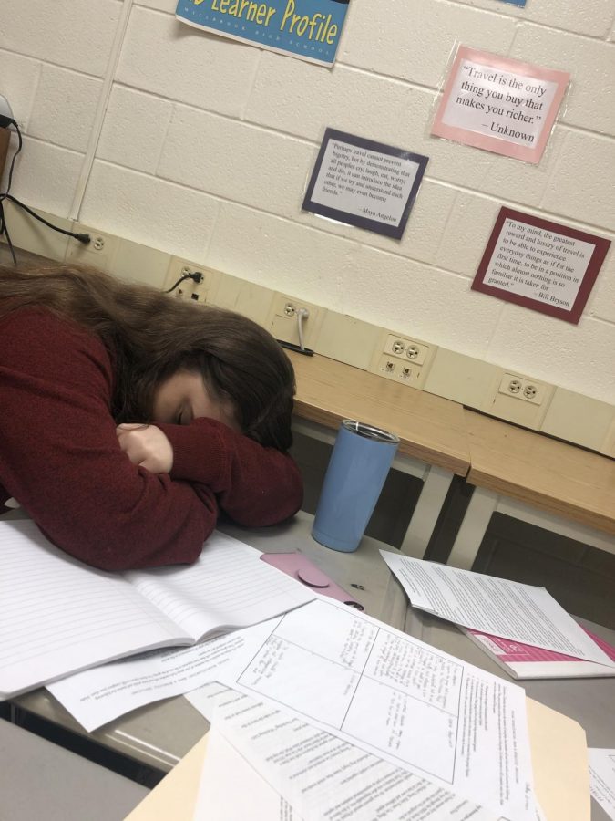 Swamped+in+classwork%2C+senior+Mckayla+Sine+chooses+to+take+a+nap+instead.+Getting+your+work+done+in+class+as+much+as+you+can+will+help+to+avoid+panicking+later+on.