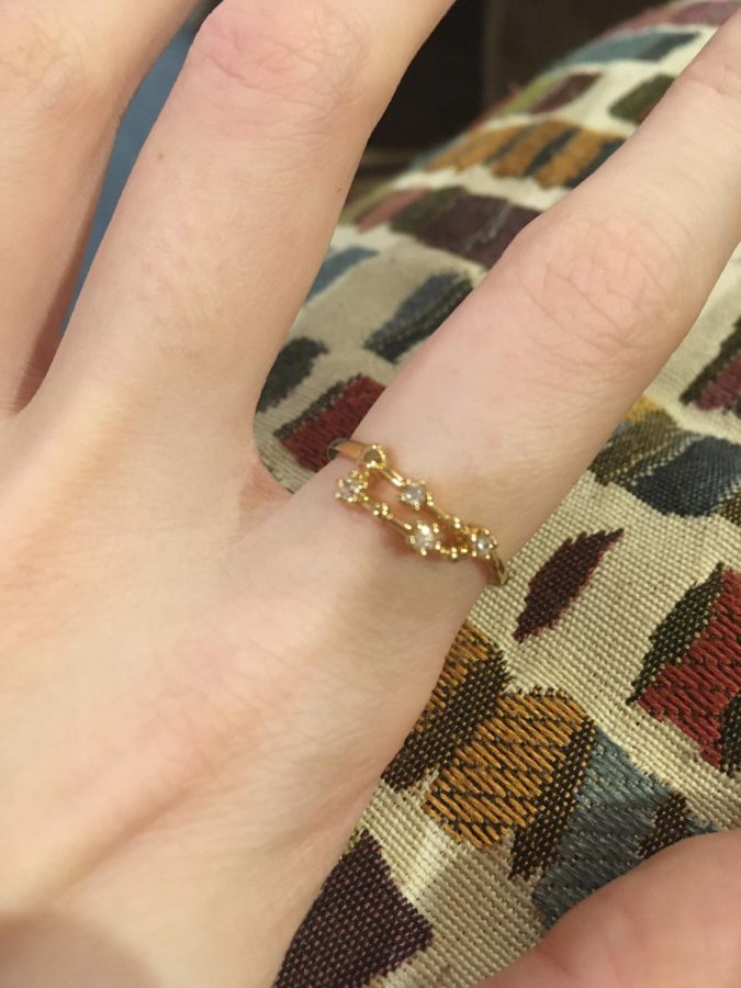 Showing off her new Capricorn inspired ring, junior Casey Parzygnat is proud of her zodiac sign and what it says about her. She believes that since she is a Capricorn, she has a stronger work ethic and a closer bond with her family members. 