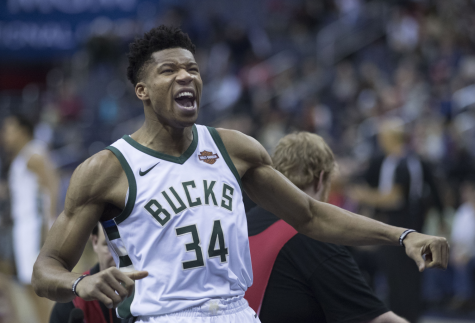 Celebrating after a big play on the offensive end, Giannis Antetokounmpo flexes his muscles at the opposing crowd. Antetokounmpo was given his second-straight MVP trophy after a record-setting season in which he averaged the lowest minutes per game in the award’s history.
