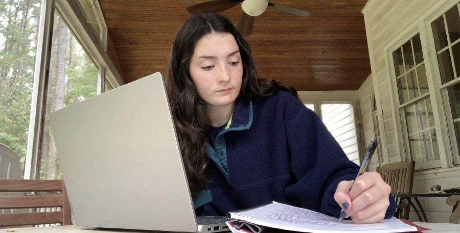 Working on their laptop, Millbrook sophomore Sara-Kathryn Francis works to finish classwork on her own time. Sara-Kathryn used her asynchronous day to complete assignments at her own pace and to relax without being signed in to class. This is a prime example of how many students spend their asynchronous days, still doing school work, but doing it more comfortably.
