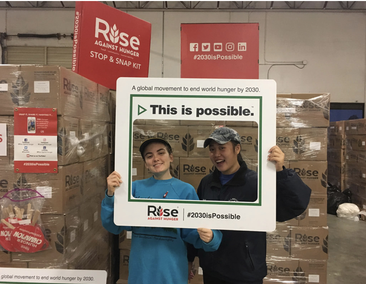 Working hard for Rise Against Hunger last December, former Key Club members Sam McCreary and Emily Ni volunteer their time to help others. Even though Key Club’s service projects may look different this year due to social distancing, they are still trying to get help to those who in need this holiday season. 
